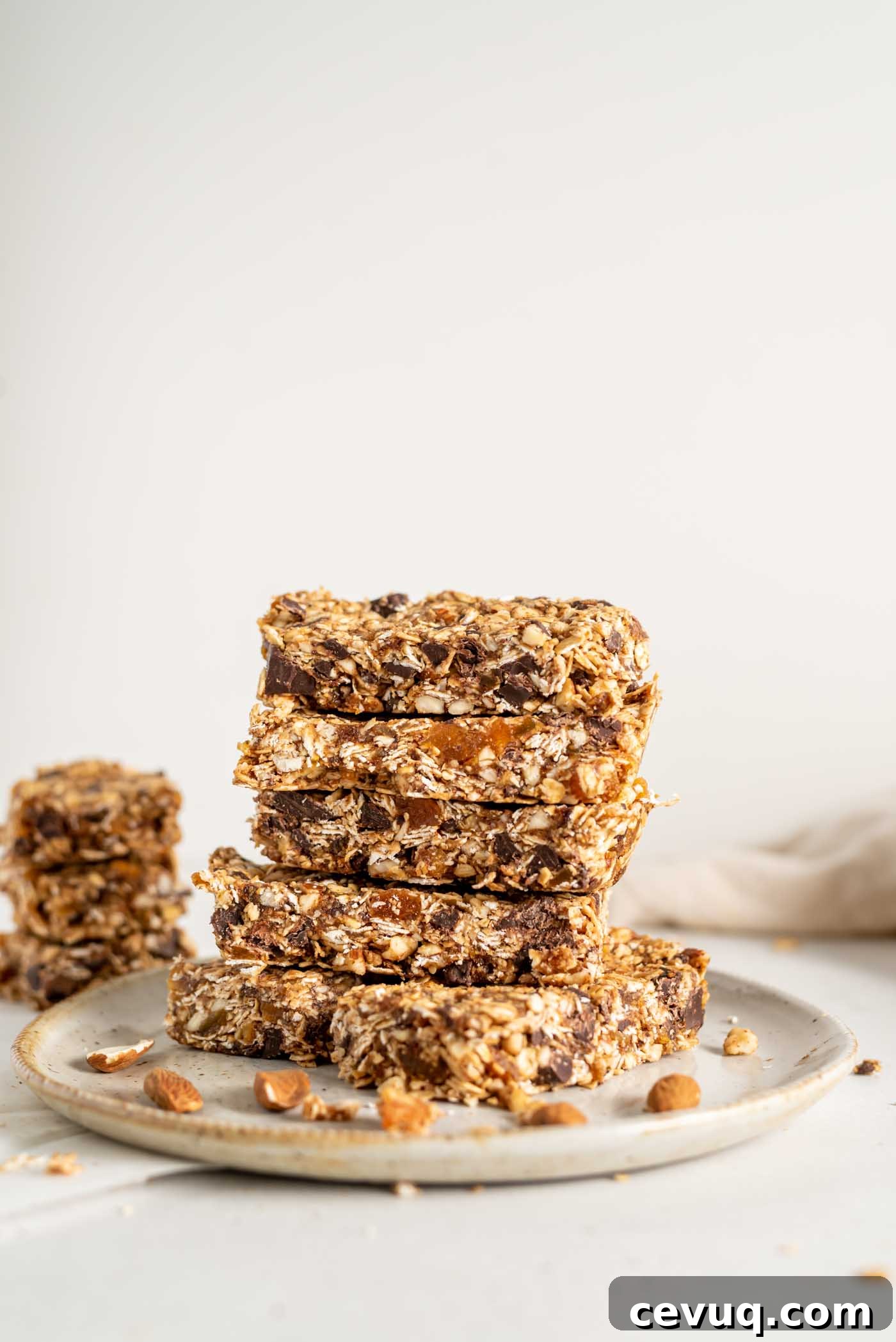 A stack of homemade granola bars on a plate.