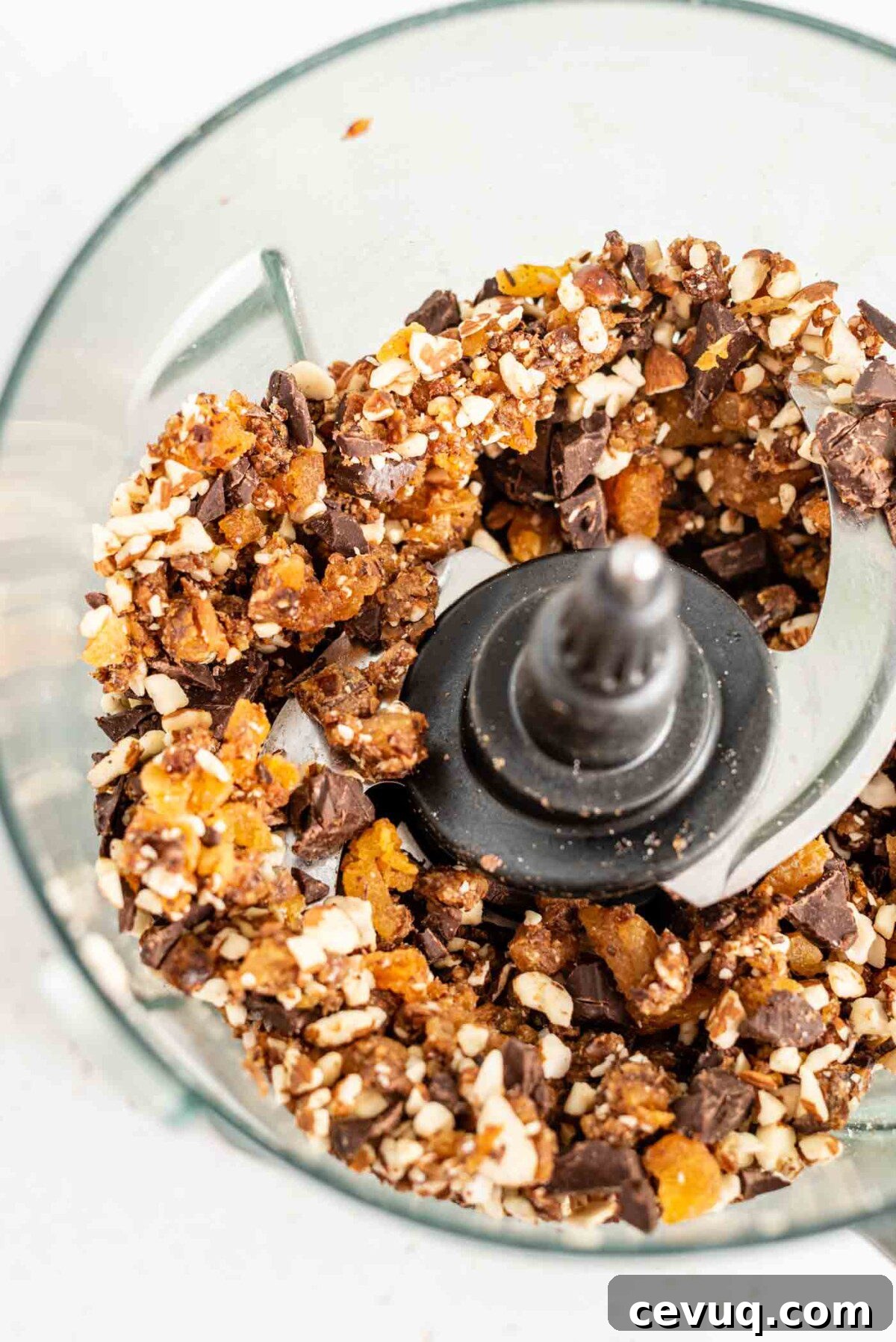 Blended dates, apricots, almonds and dark chocolate in a food processor.