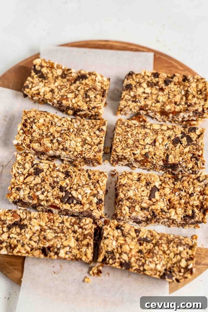 8 large granola bars on a cutting board.