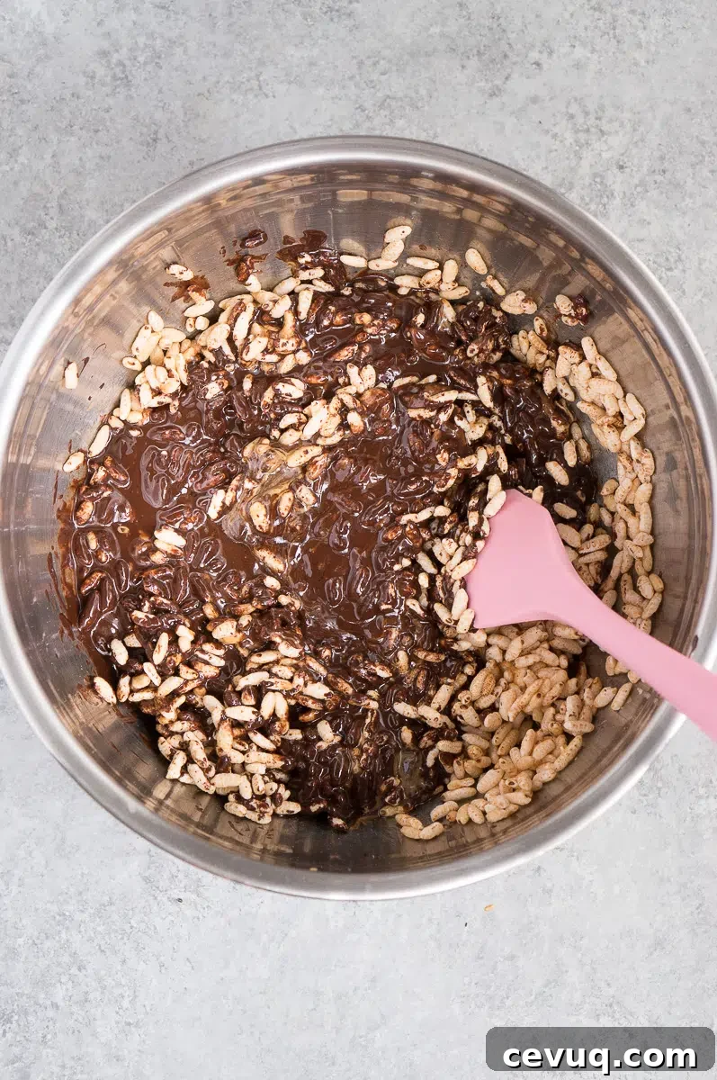 mixing rice puffs, peanut butter and chocolate
