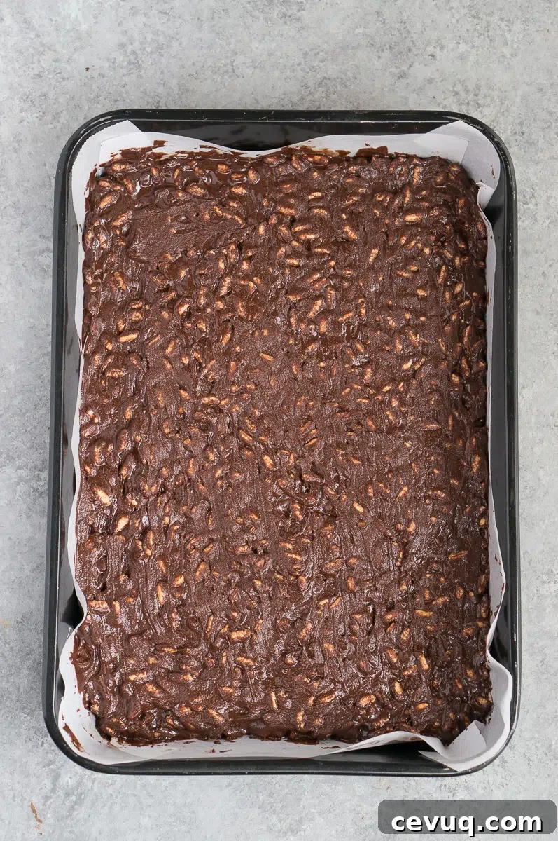 chocolate crunch mixture in a pan before freezing