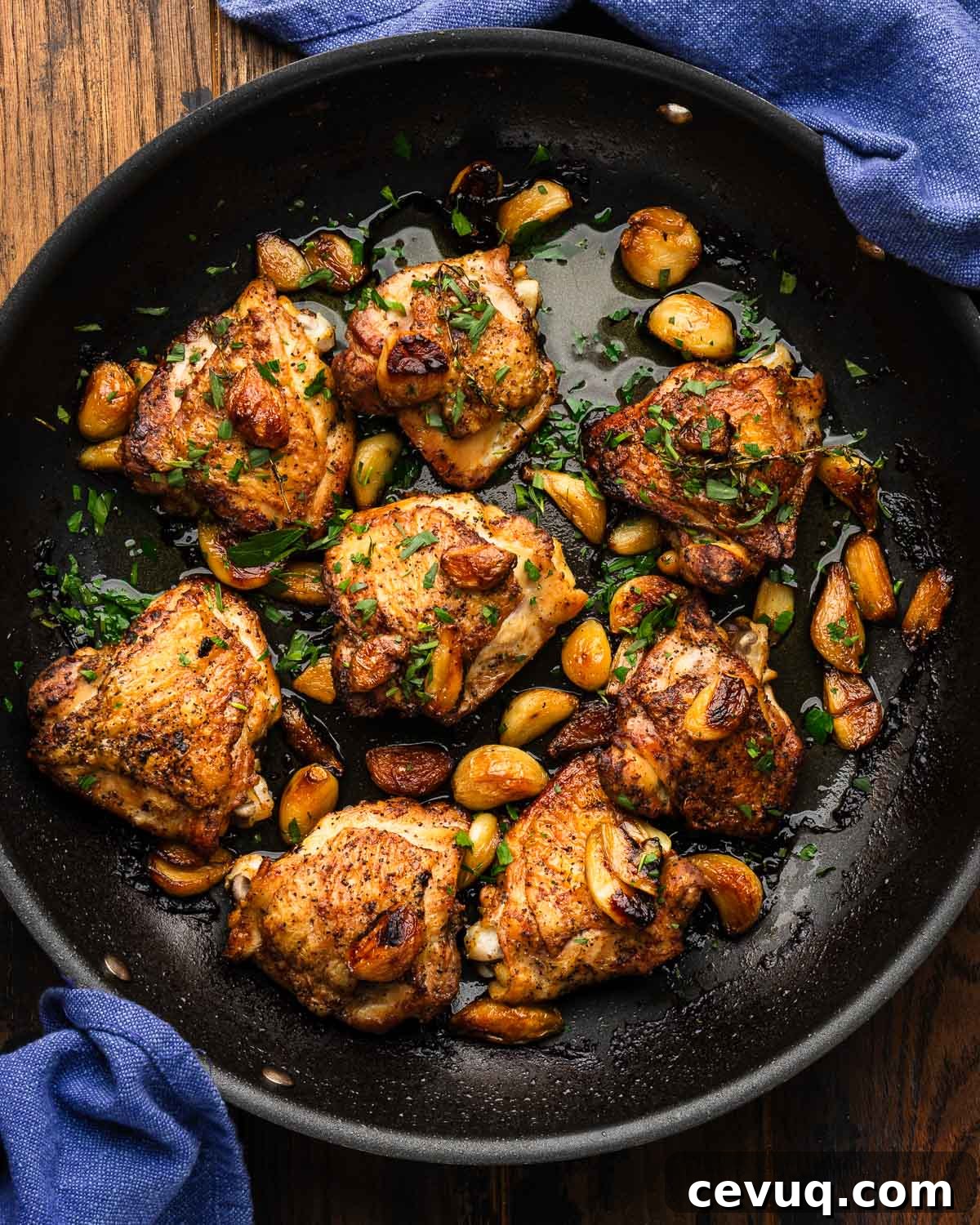 Garlic-Infused Roasted Chicken with 40 Cloves 2 Large black with forty clove garlic chicken thighs.