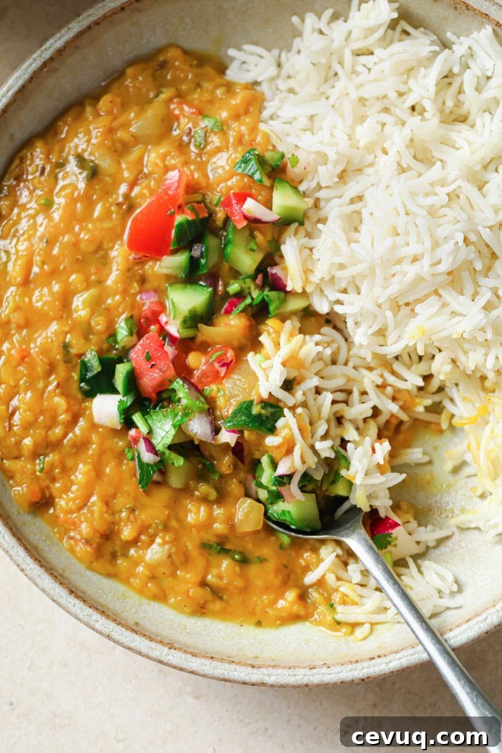 Half-eaten bowl of Masoor dal and rice.