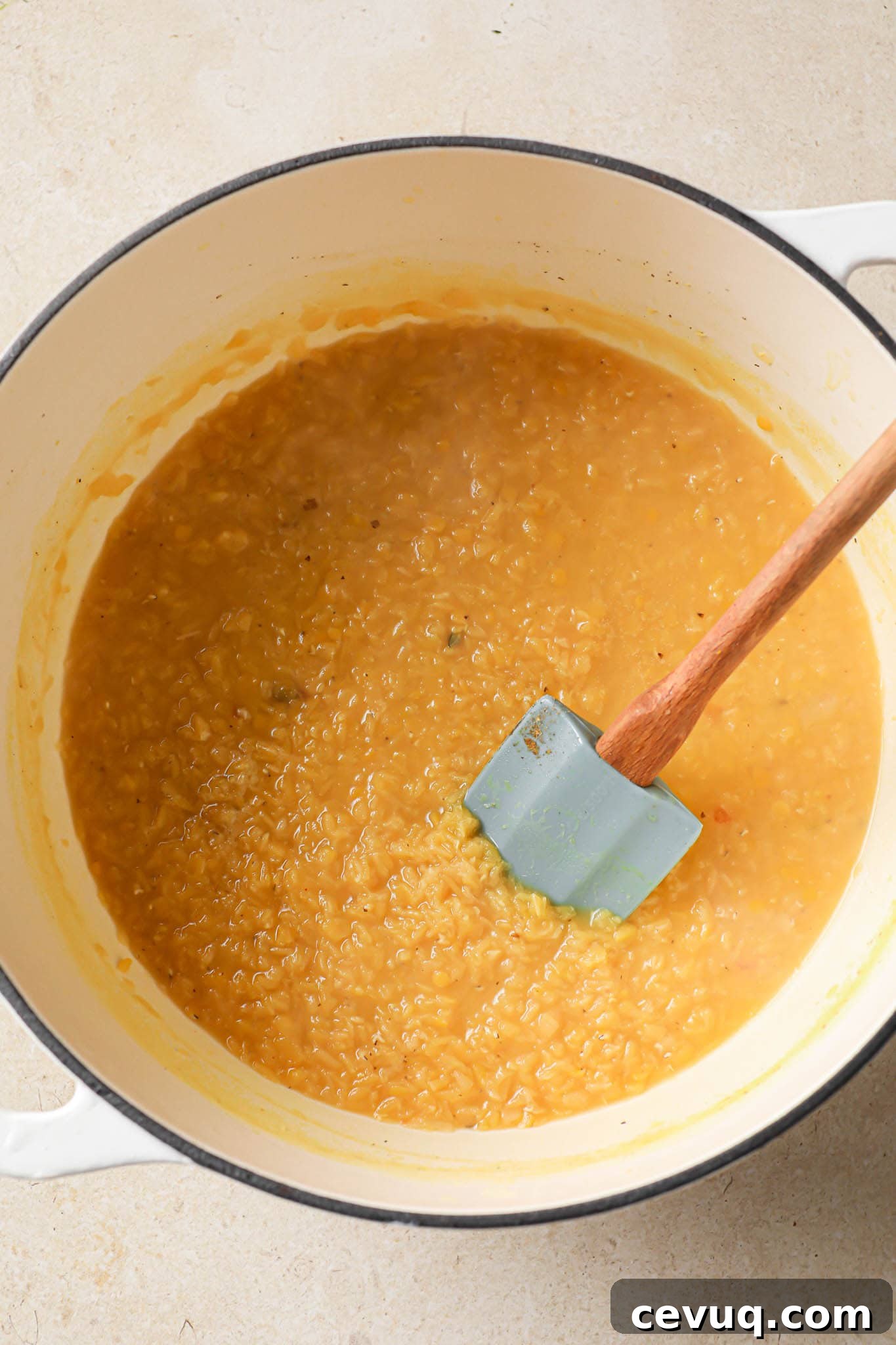 Cooked Red lentil added to tarka dal.