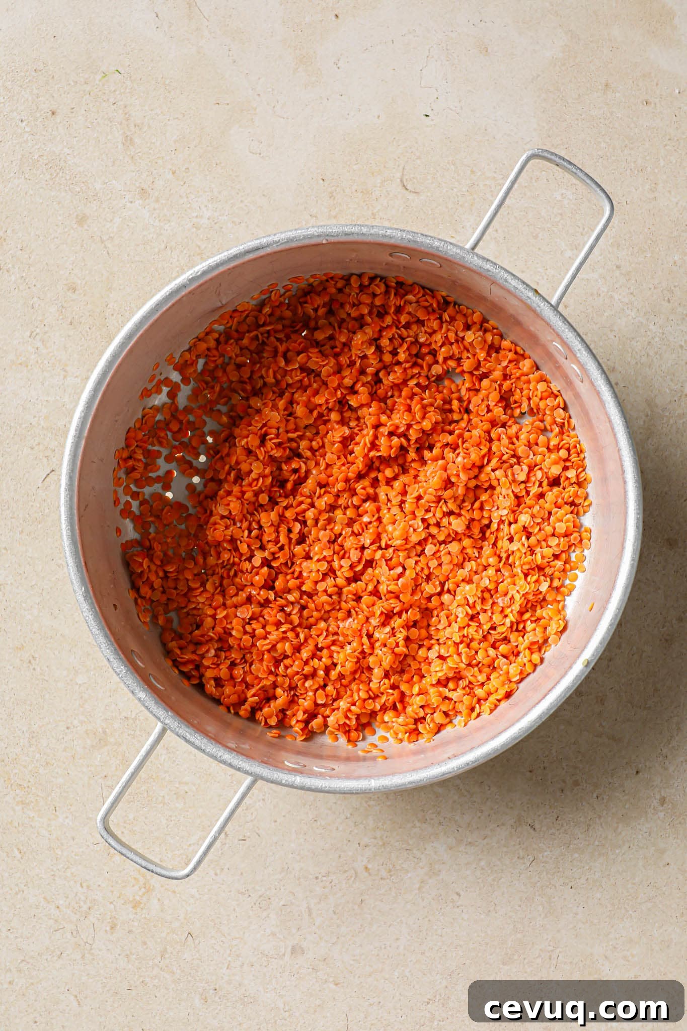 Drained raw masoor dal.