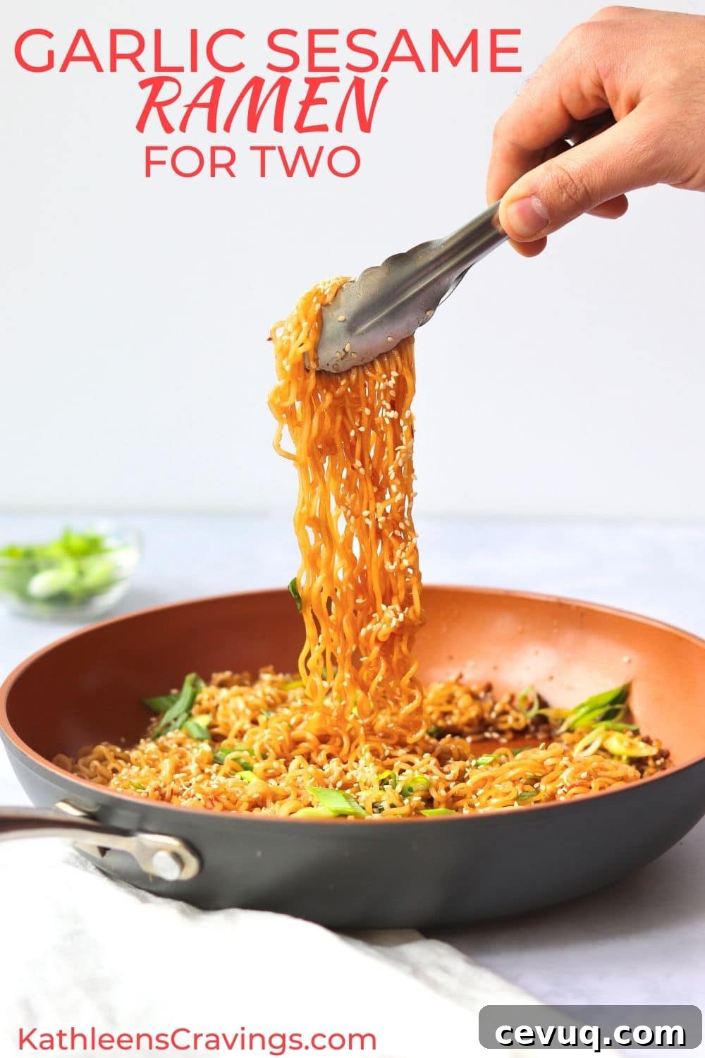 Garlic Sesame Ramen for Two: Quick Homemade Recipe 2 Garlic sesame ramen in a skillet with tongs pulling some noodles up