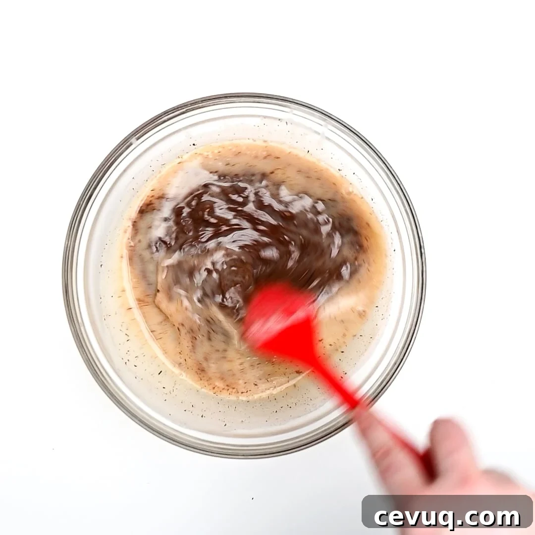 Chocolate mixture being stirred.