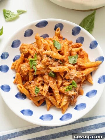 Pink sauce with penne on a plate.