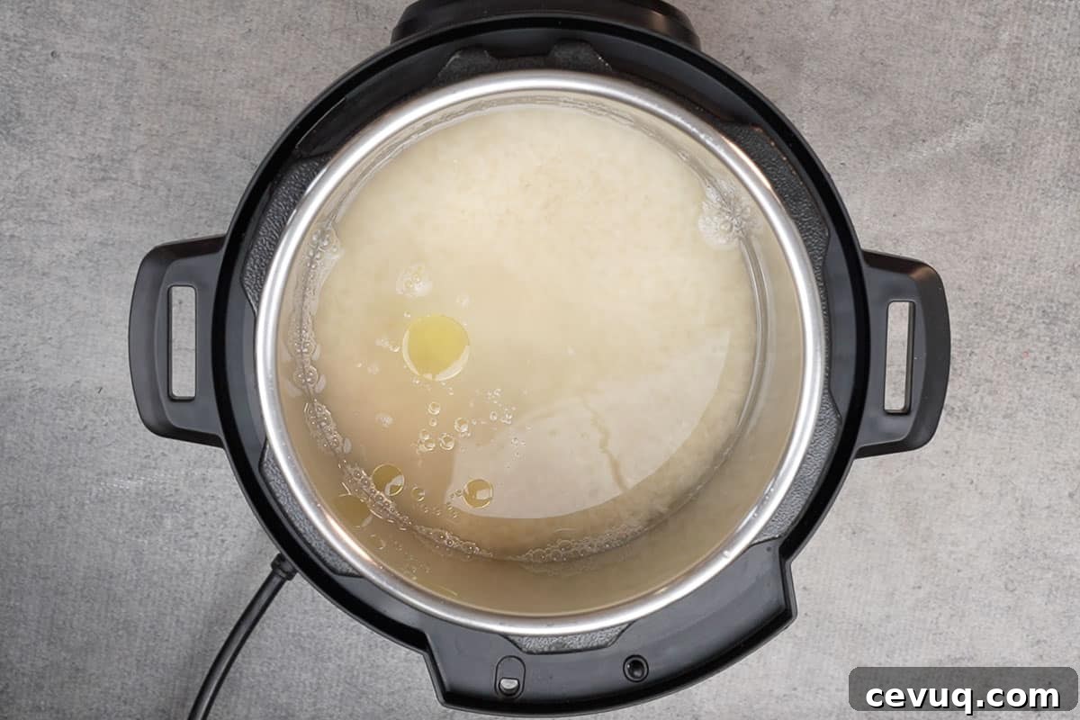 Water, lemon juice, oil and salt added to the pot.