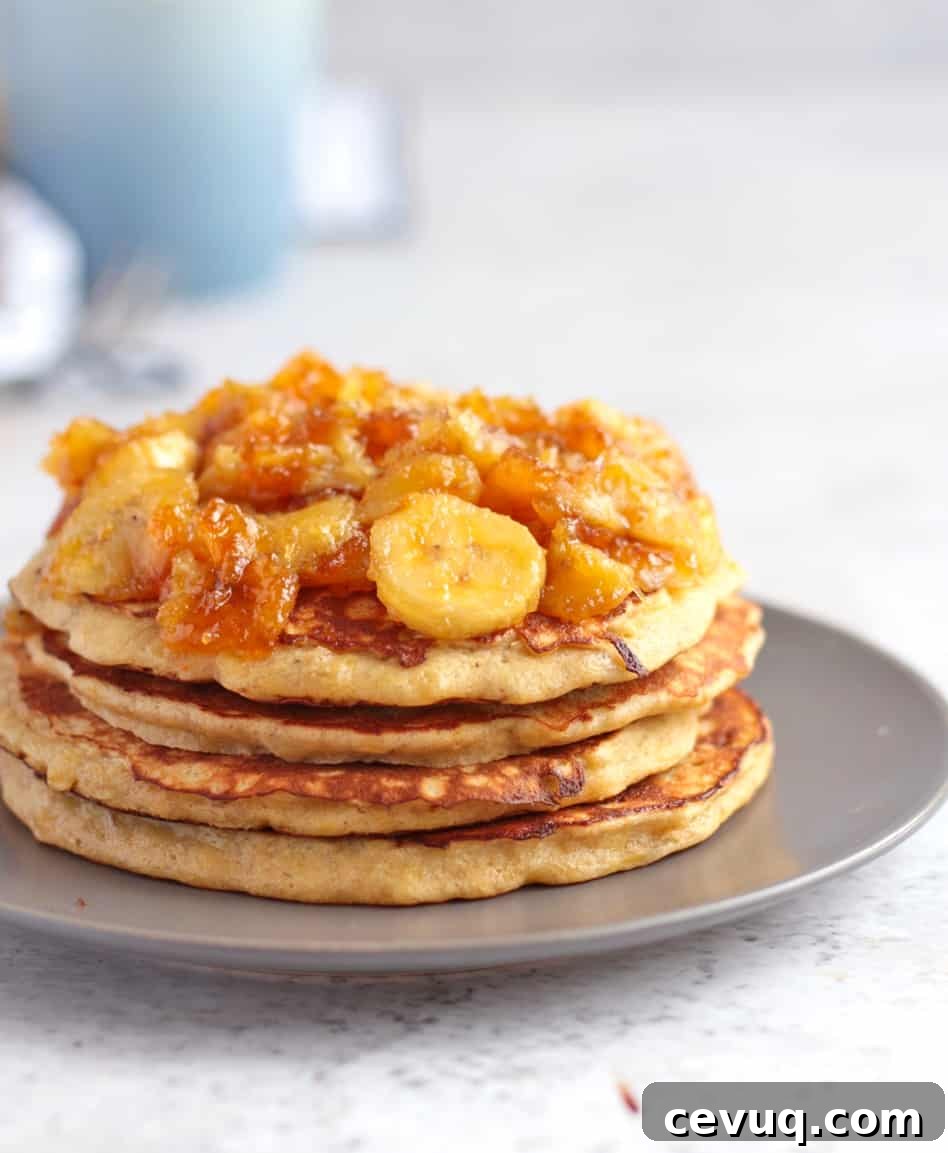Close up on the side of the pancakes topped with the caramelised banana topping.