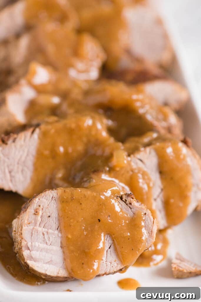 Juicy Instant Pot Pork Tenderloin Recipe for Quick Dinners 2 sliced pork tenderloin with gravy