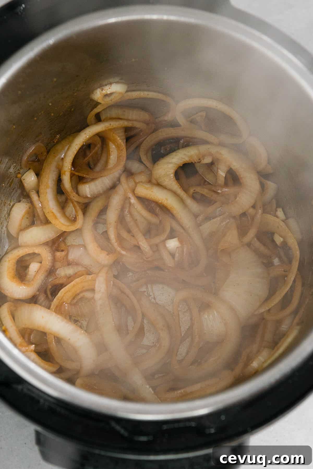 Juicy Instant Pot Pork Tenderloin Recipe for Quick Dinners 6 sautéed sliced onions in Instant Pot