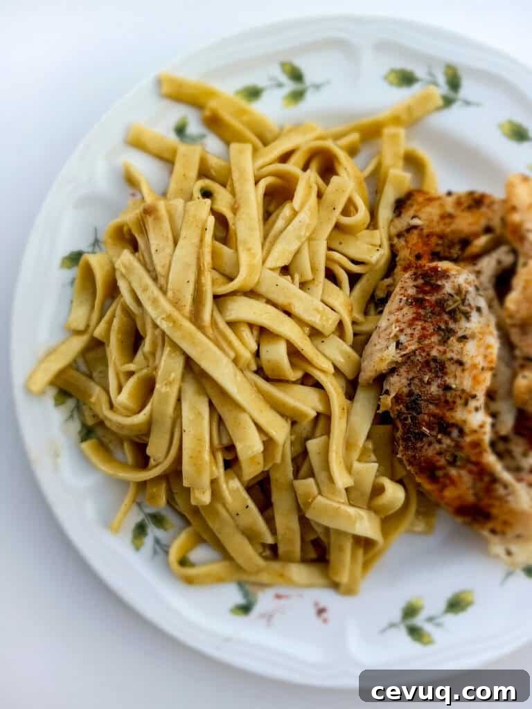 a plate with Amish noodles and chicken .