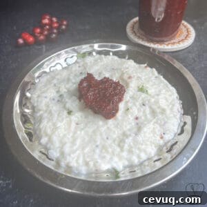 Vibrant cranberry pickle served with traditional South Indian cuisine.