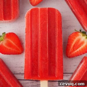 Close up of a strawberry popsicle.