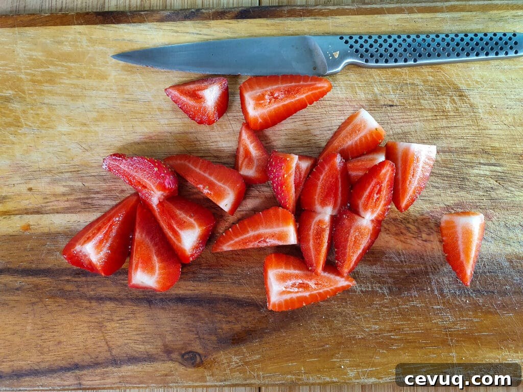 Slicing up strawberries.