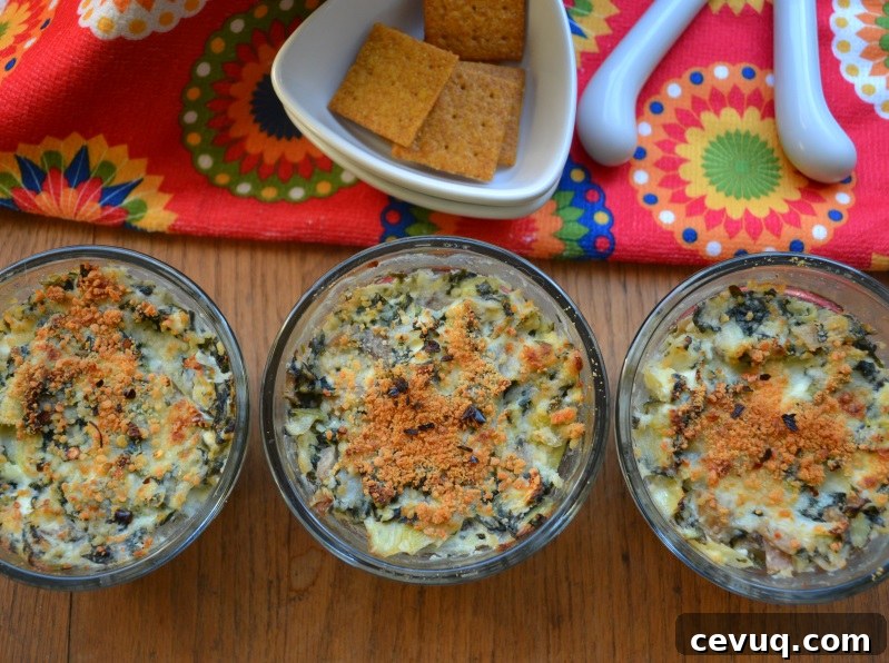 Spinach Artichoke Dip Individual Appetizers served with wheat crackers.