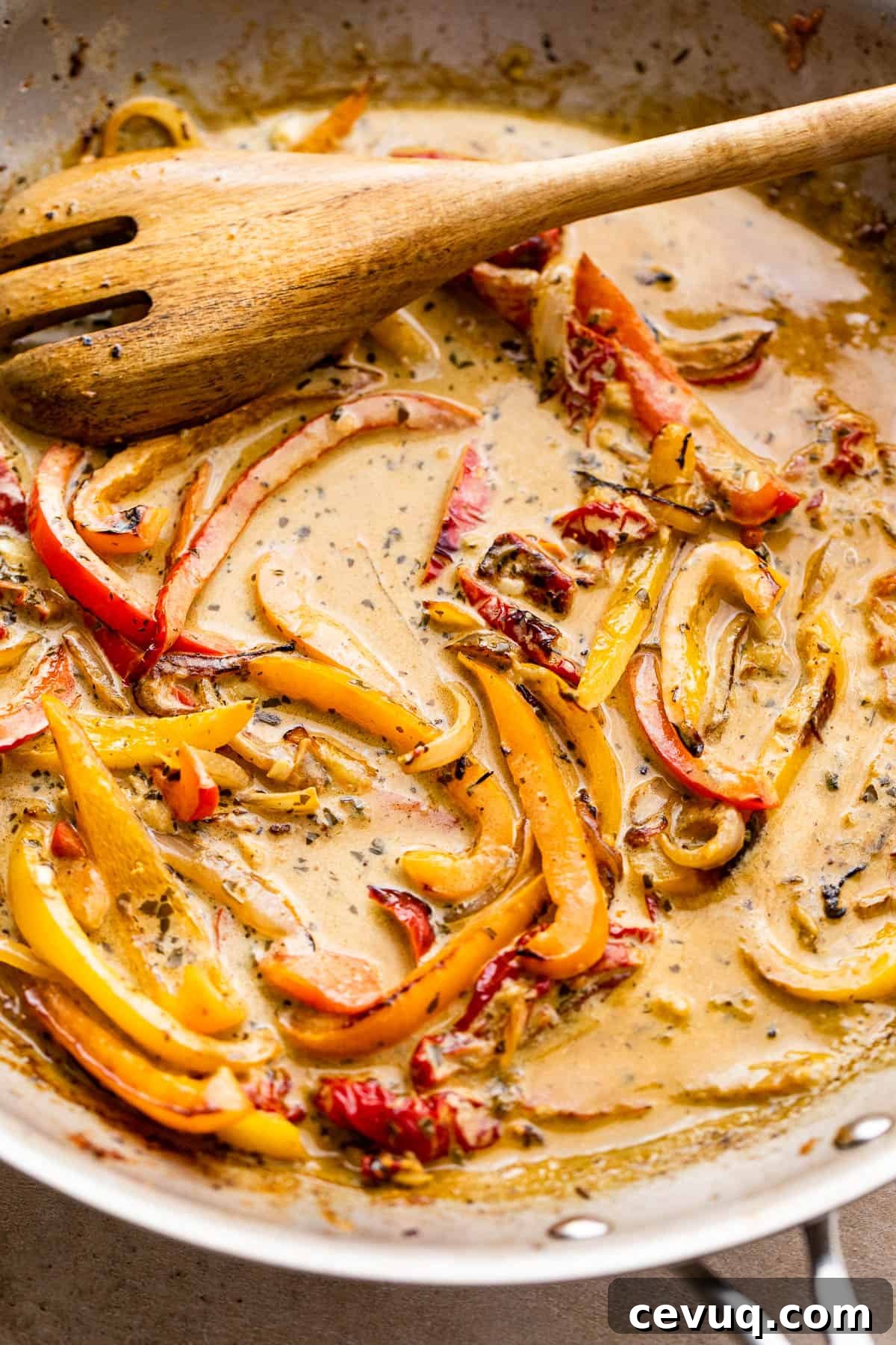 cooking bell peppers in a cream sauce with pesto