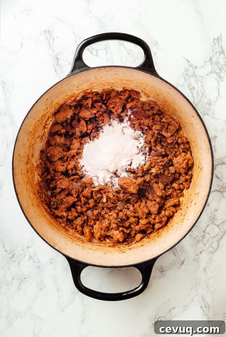 Flour added to pot of browned sausage