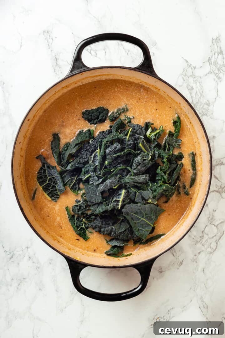 Kale added to pot of soup