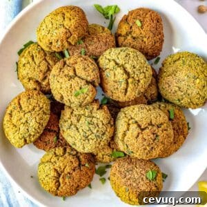 Homemade falafel stacked on a plate