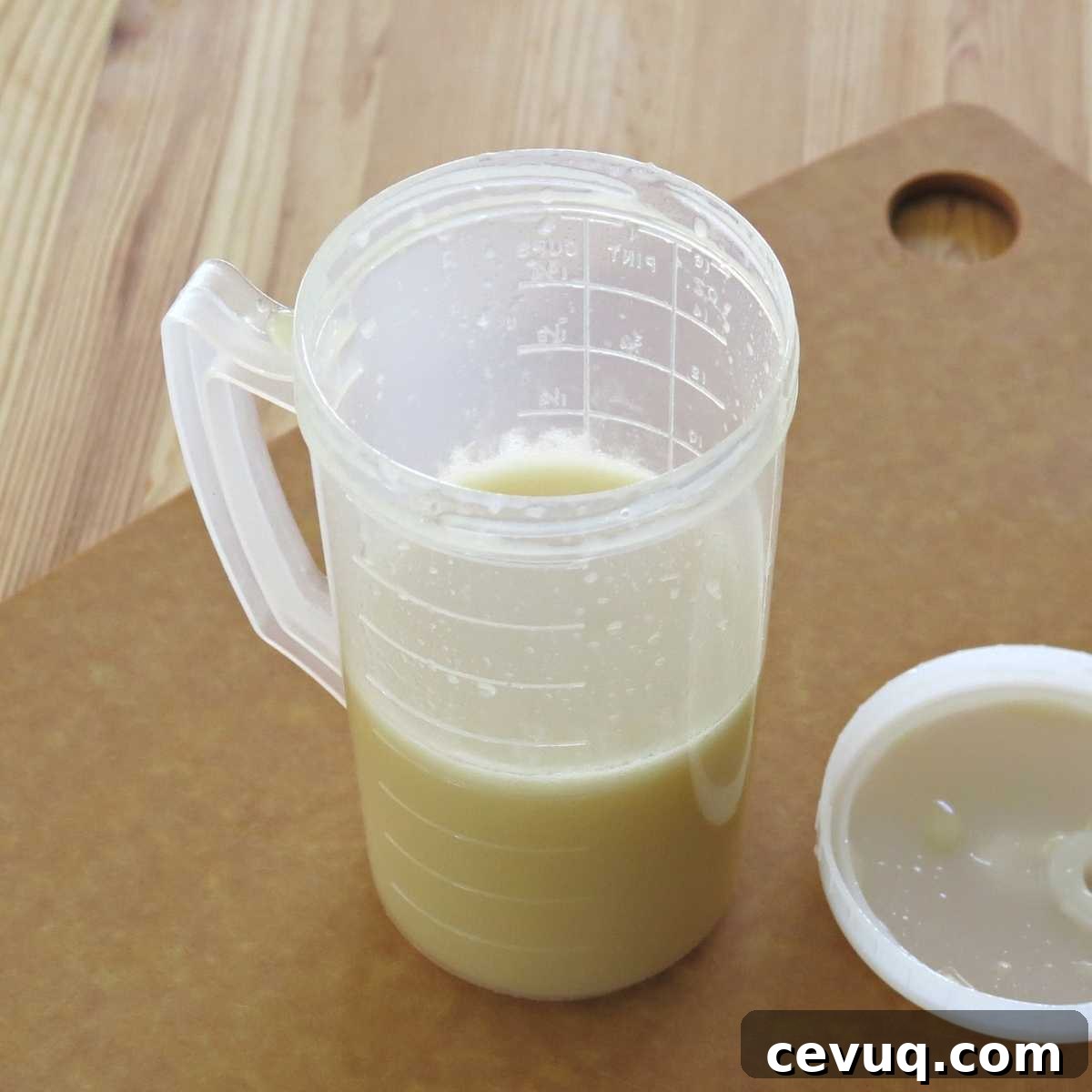 Honey lime dressing in mixing cup.