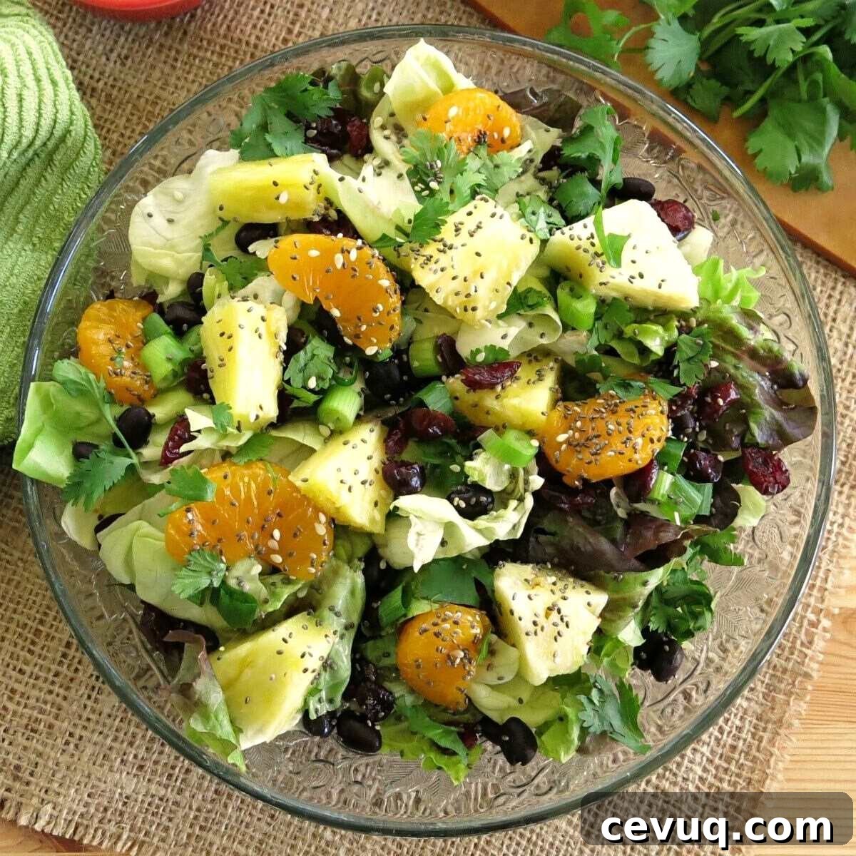 Caribbean salad with honey lime dressing on a salad plate.