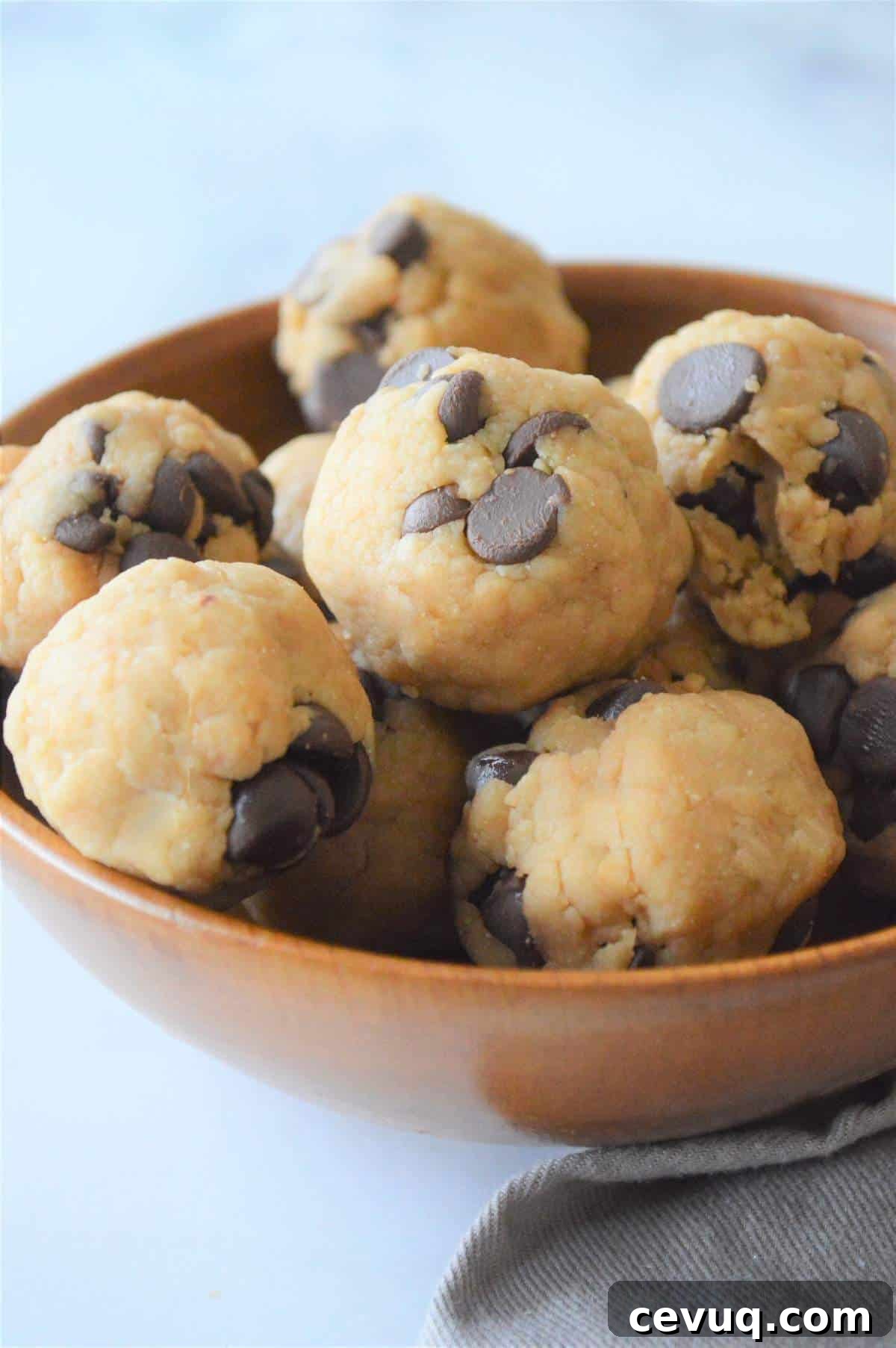 No-Bake Energy Bites Recipe for Quick, Protein-Packed Snacks 2 A bowl of no bake cookie dough energy bites.