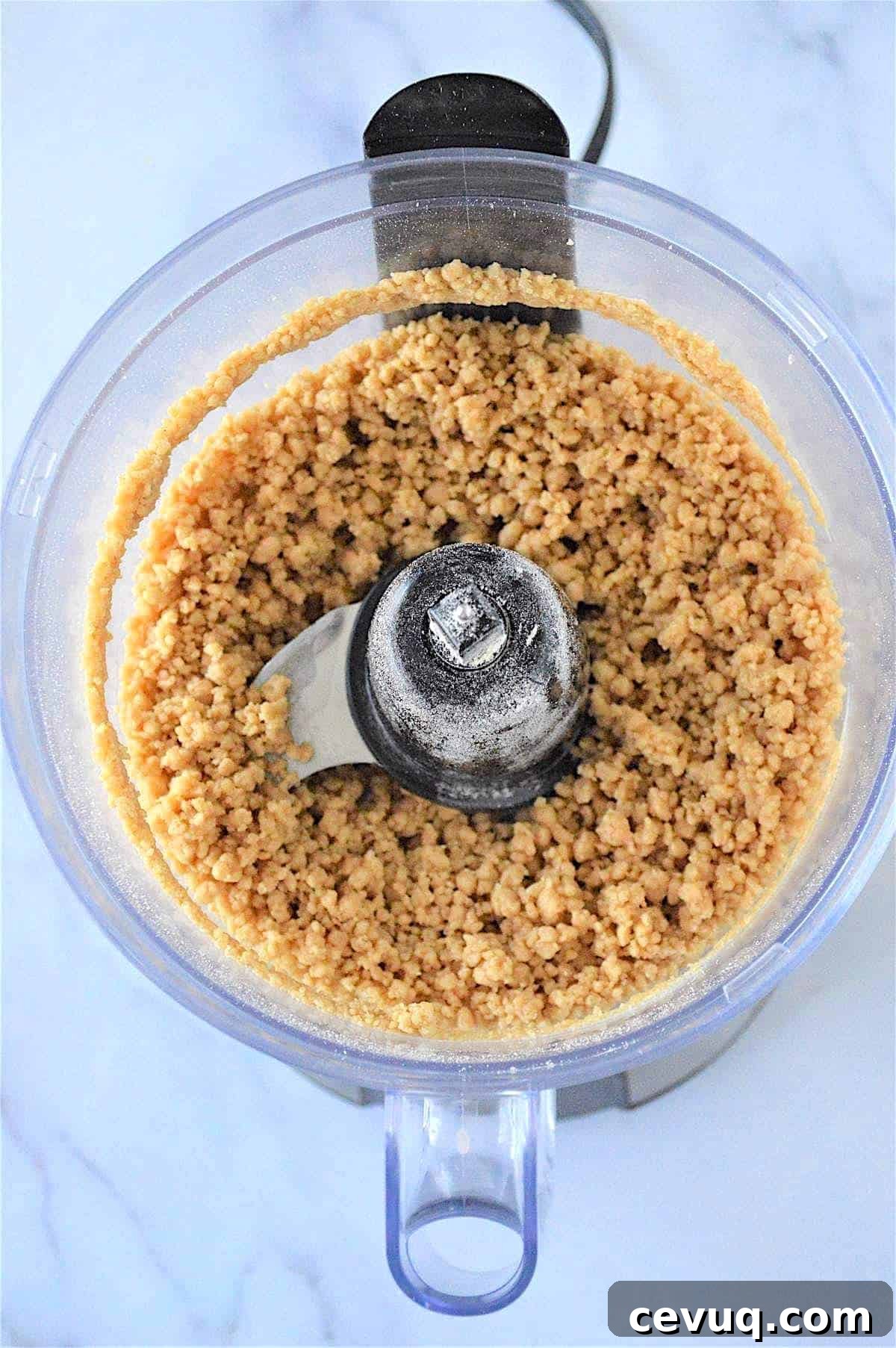 No-Bake Energy Bites Recipe for Quick, Protein-Packed Snacks 6 No bake energy ball dough in a food processor.