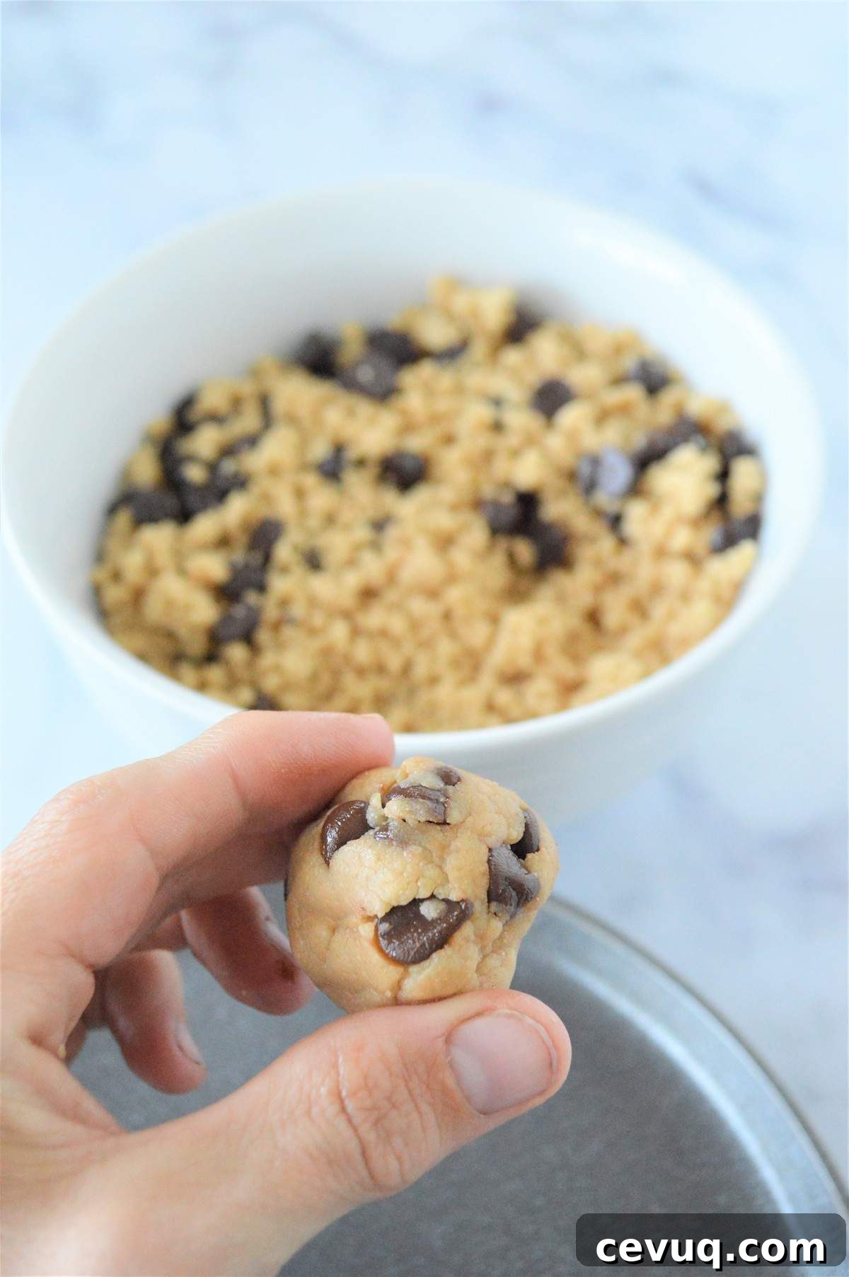 No-Bake Energy Bites Recipe for Quick, Protein-Packed Snacks 8 A process image showing how to roll no bake energy bites into balls.