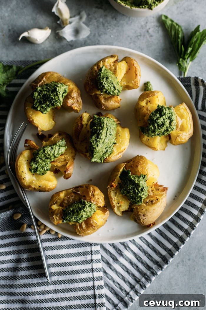 Pesto Smashed Potatoes | CRISPY smashed potatoes topped with kale pesto, aka the perfect side dish!