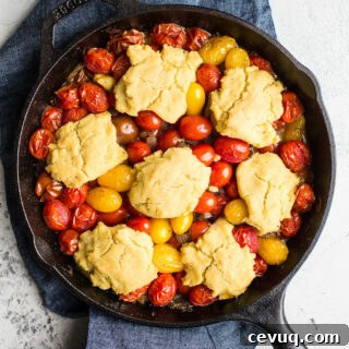 Gluten-Free Tomato Cobbler with Corn Flour Biscuits makes for savory side dish or a vegetarian main course. An easy tomato cobbler recipe that is vegan too!