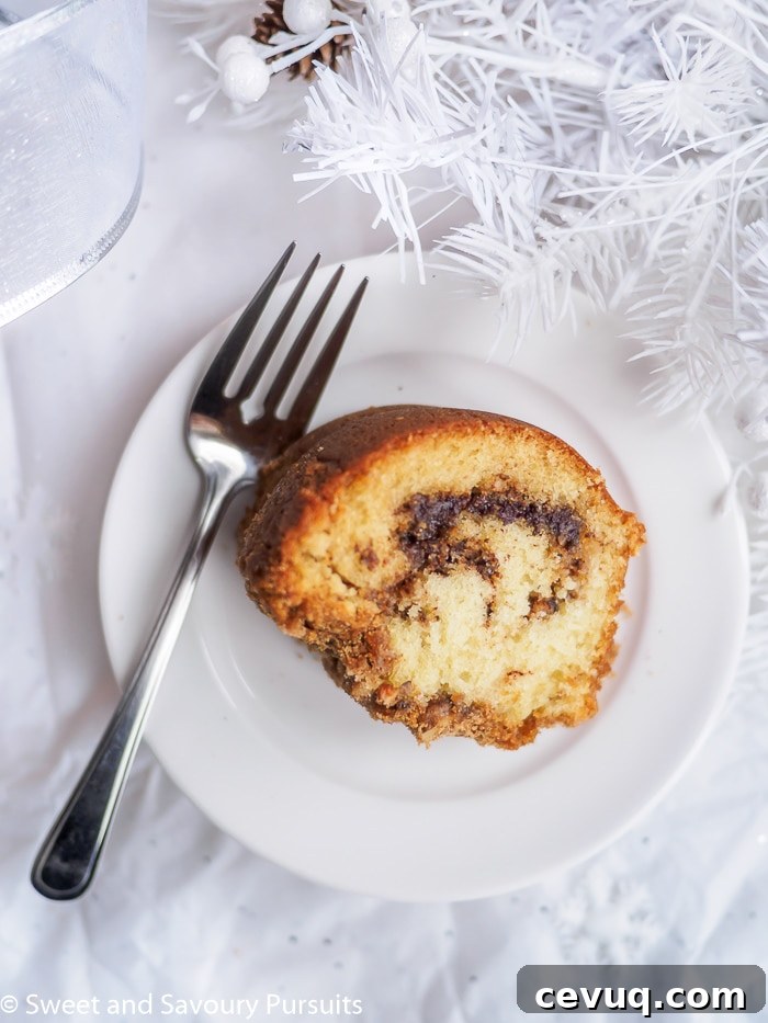 Slice of Cinnamon Swirl Cake on small white plate.