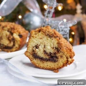 Slice of chocolate cinnamon bundt cake on small dish.
