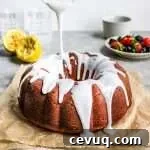 spring lemon Bundt cake pouring icing over cake
