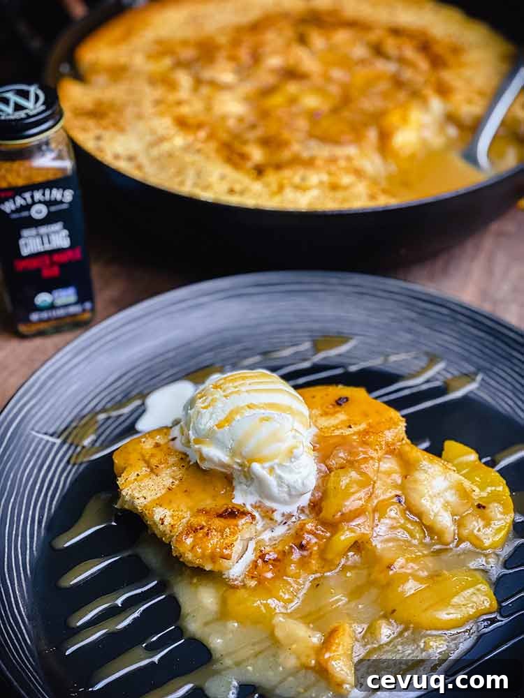 Peach cobbler topped with ice cream