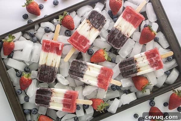 Fourth of July popsicles on a sheet pan and ice