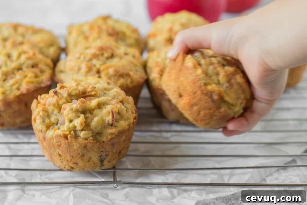 kids hand grabbing a muffin