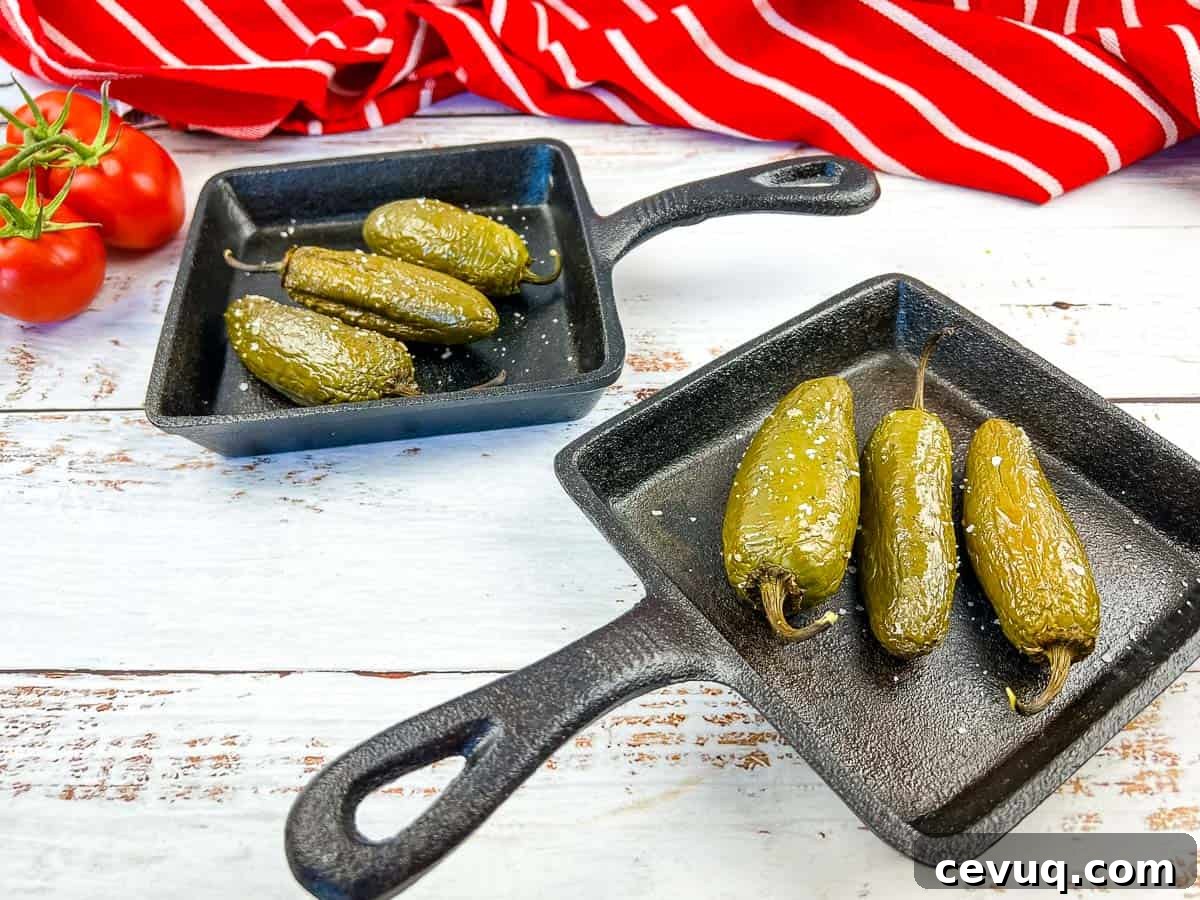 Smoked Jalapenos in 2 cast iron pans.