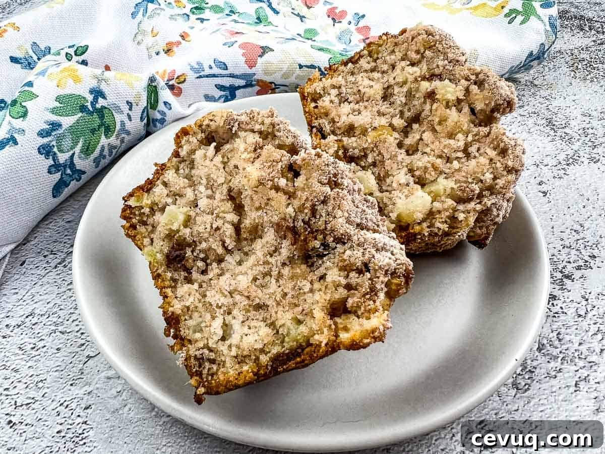 A cut muffin on a plate.