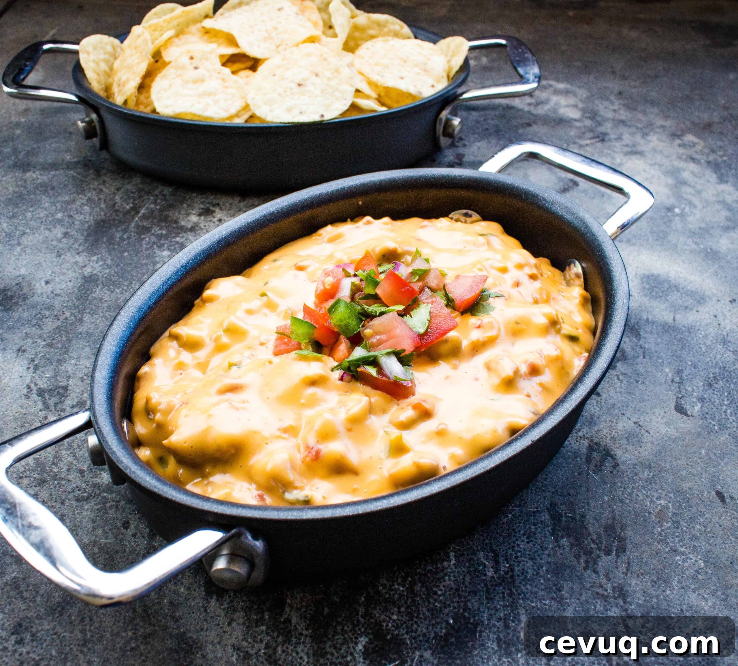 Smoked queso in a black pot.