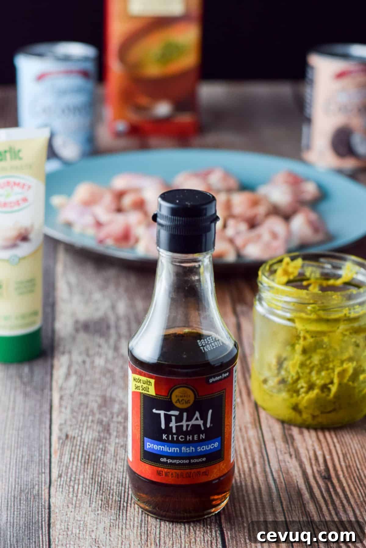 Fish sauce, curry paste, garlic paste, coconut milk and cream, broth and chicken chunks