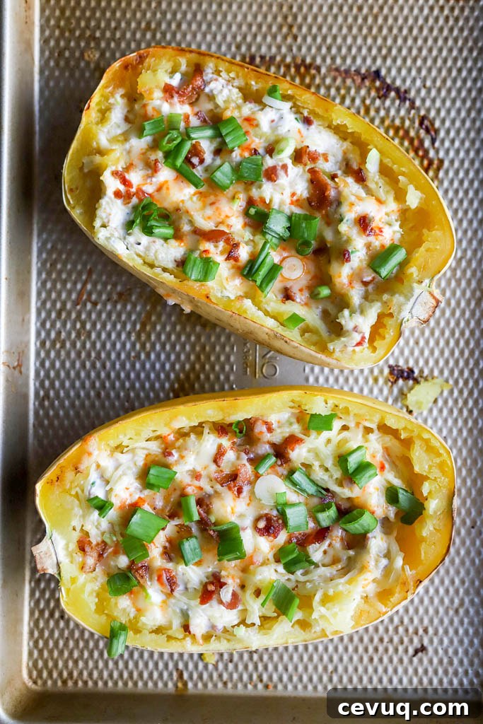 top down view of jalapeno popper stuffed spaghetti squash on baking sheet