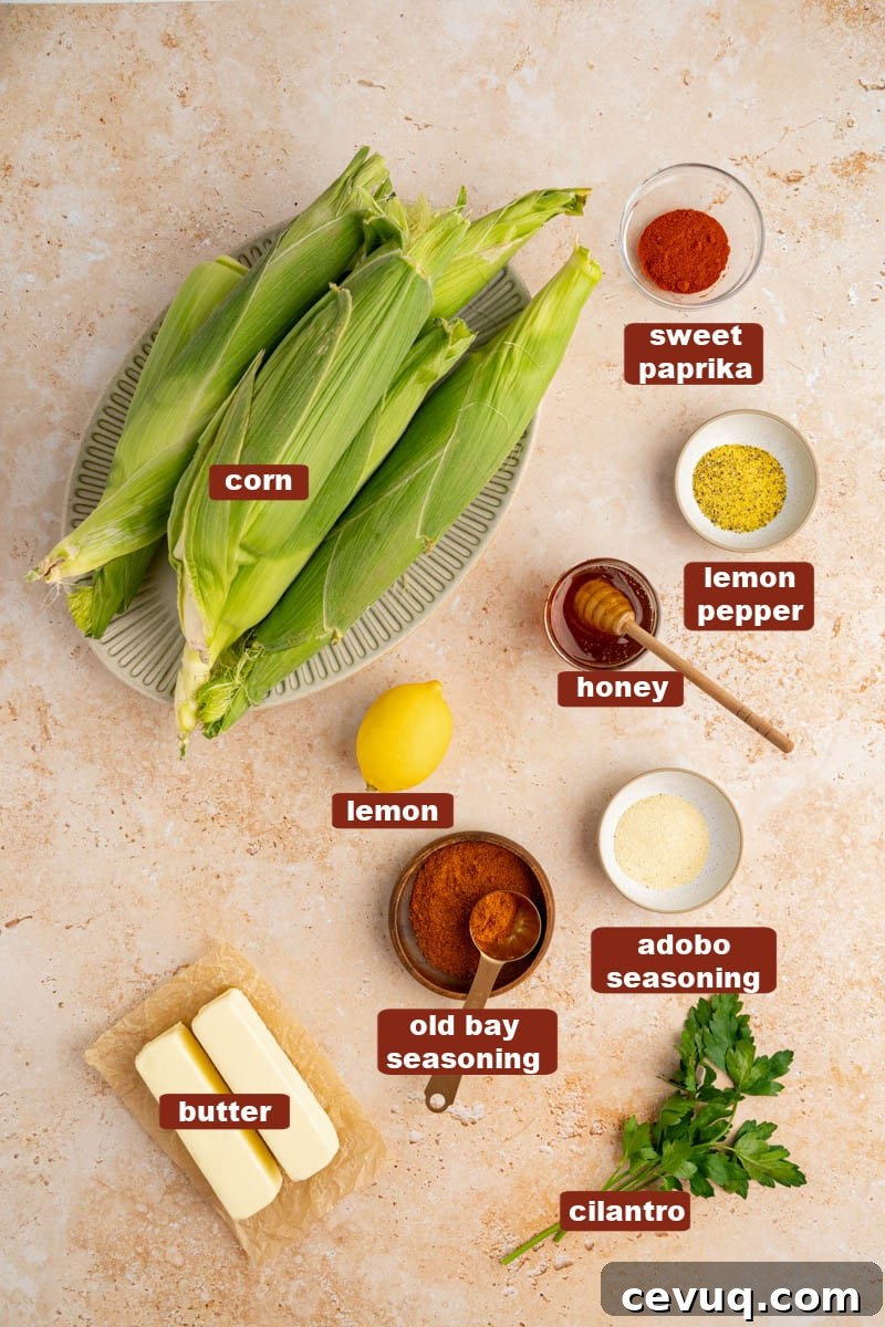 All of the ingredients for cajun butter corn on a countertop.