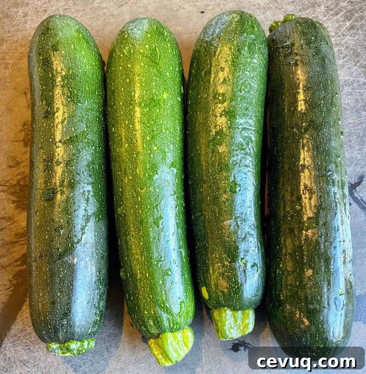 4 zuccini on a cutting board