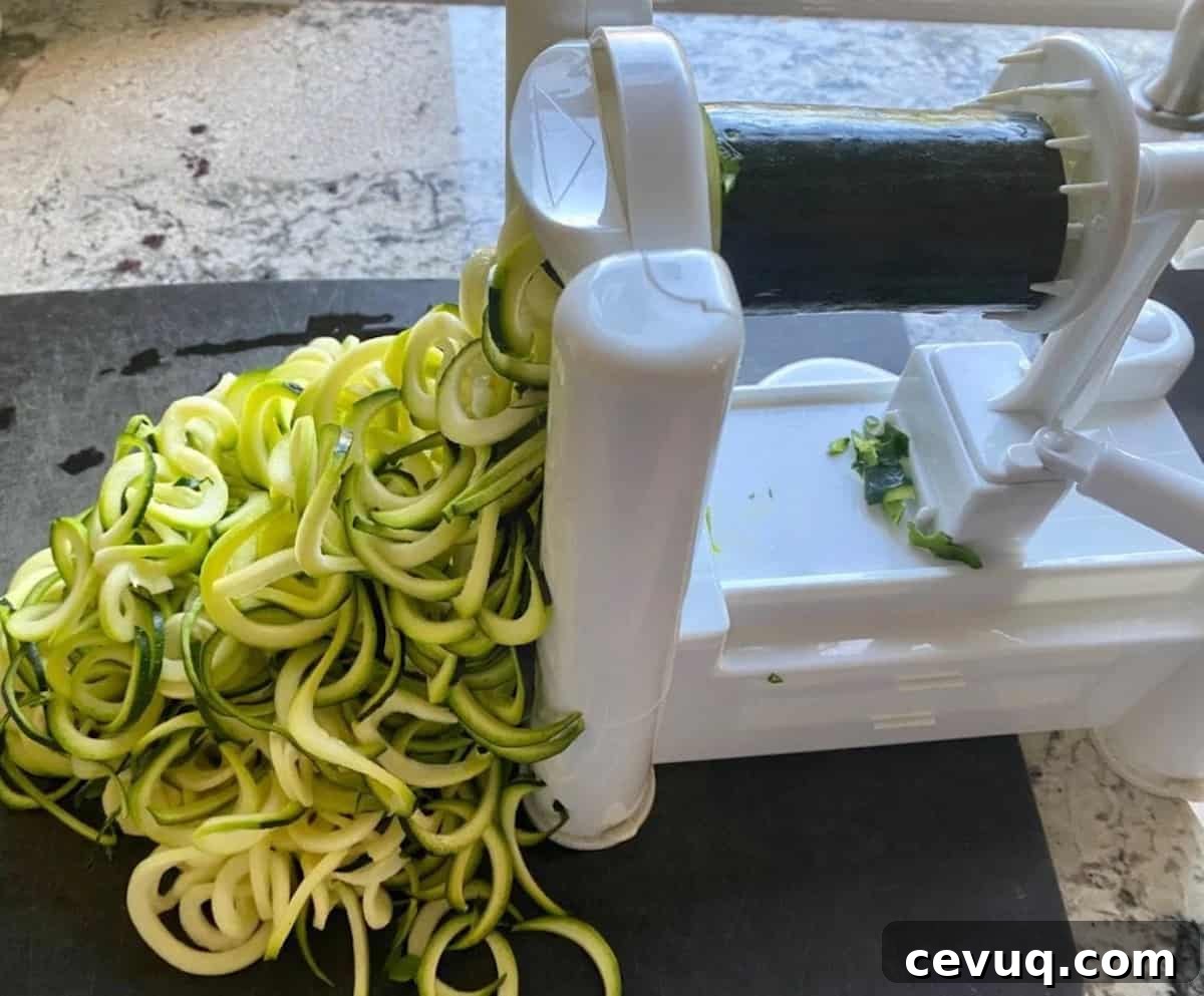 Spiralizing zucchini on the counter using a spiralizer