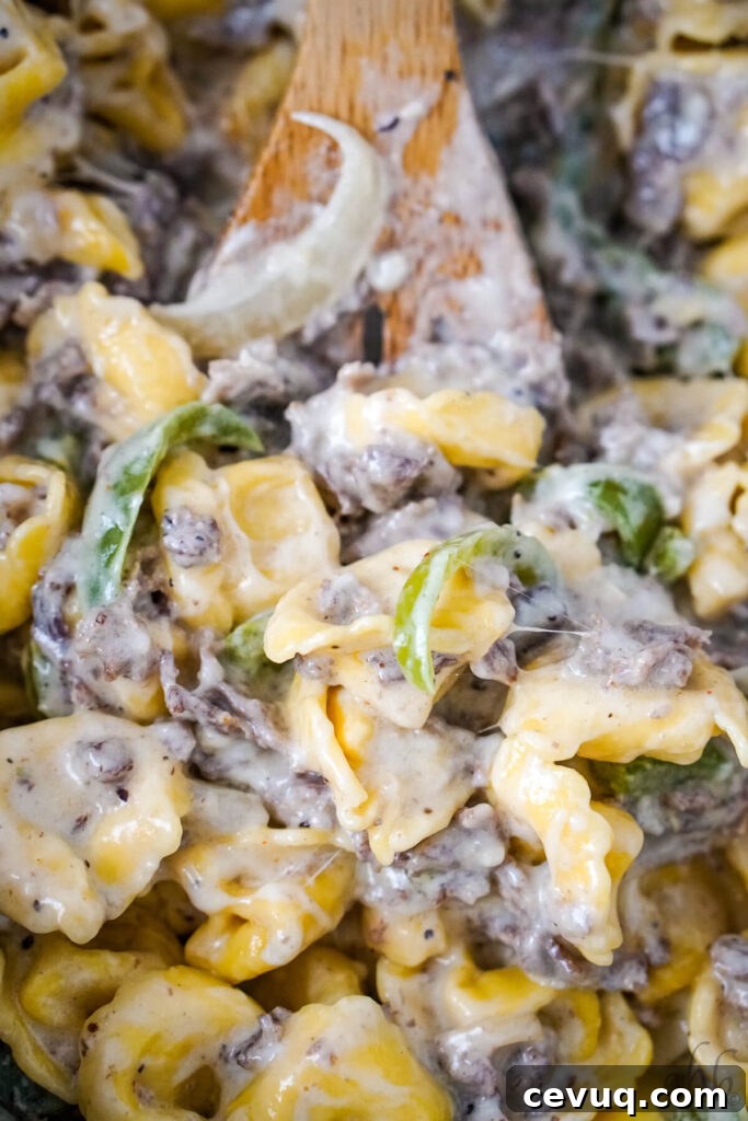 Shredded cheese is stirred into the mixture.