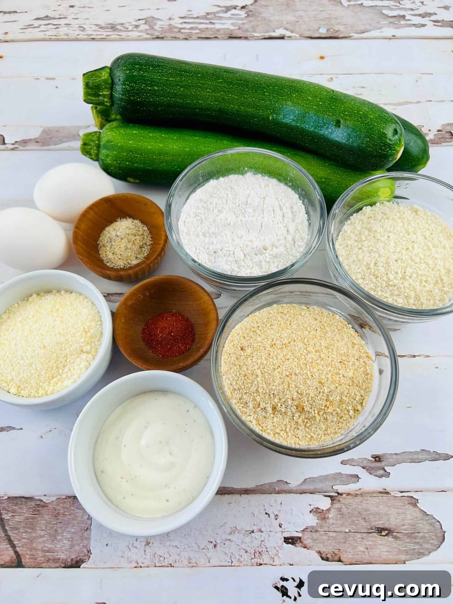 Zucchini with breading, eggs, flour and seasoning.
