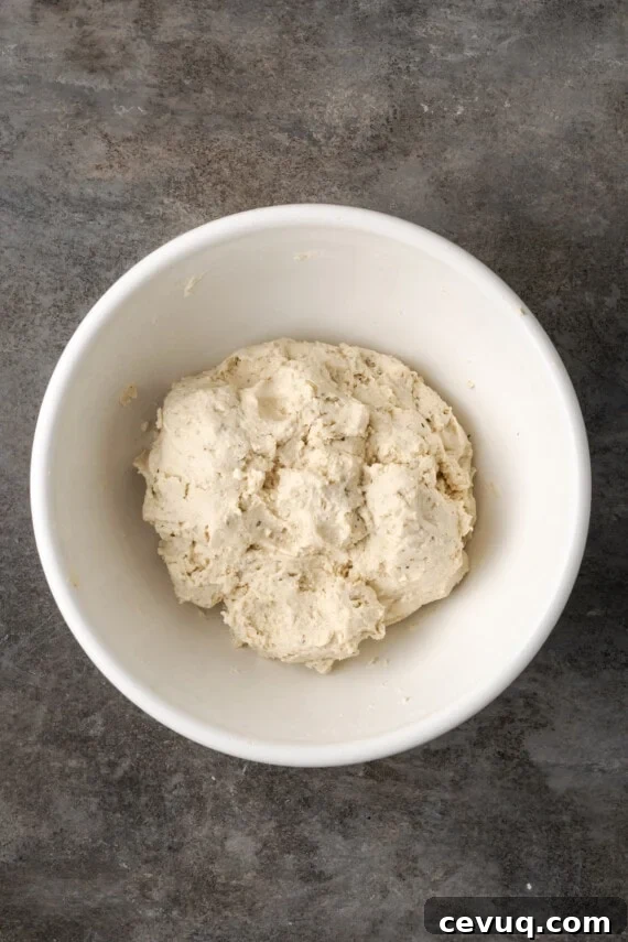 A ball of Bisquick dough in a white bowl.