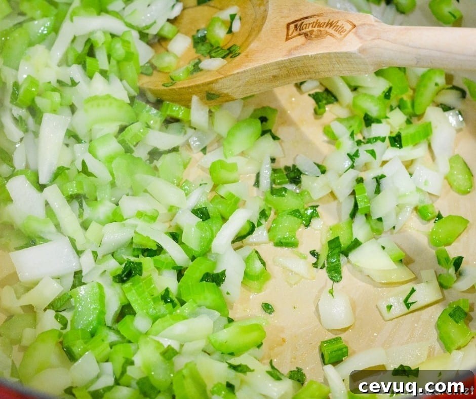 Grandma's chicken and rice soup is made from a whole chicken, onions, celery, and rice with seasonings, butter, and Better than Bouillon for spoonfuls of comfort.